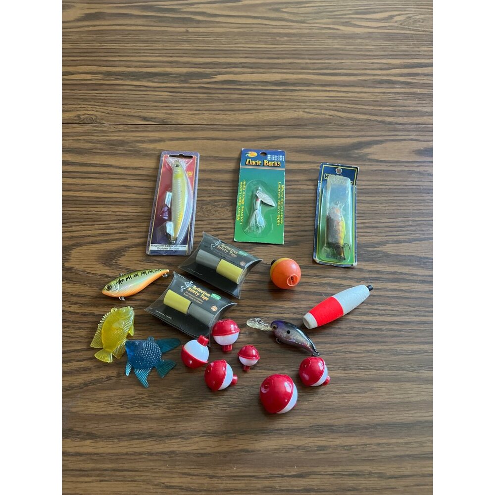 Assorted Fishing tackle lures bobbers safety tape